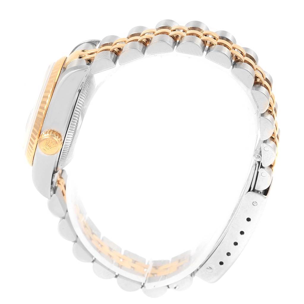 The image shows a side view of a Rolex Datejust 79173 Women's Steel and Gold (two tone) Beige Dial 79173 Women's Steel and Gold (two tone) Beige Dial watch, highlighting the crown, case, and two-tone jubilee bracelet.