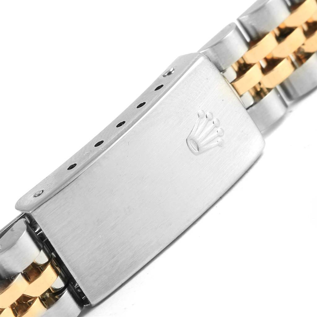 The image shows the clasp of a Rolex Datejust 79173 Women's Steel and Gold (two tone) Beige Dial 79173 Women's Steel and Gold (two tone) Beige Dial watch, highlighting the crown logo and the two-tone Jubilee bracelet.