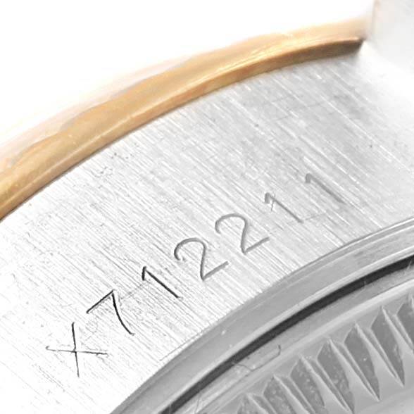 This image shows a close-up of the serial number on the case edge of a Rolex Datejust 69173 Women's Stainless Steel Silver Dial 69173 Women's Stainless Steel Silver Dial watch.