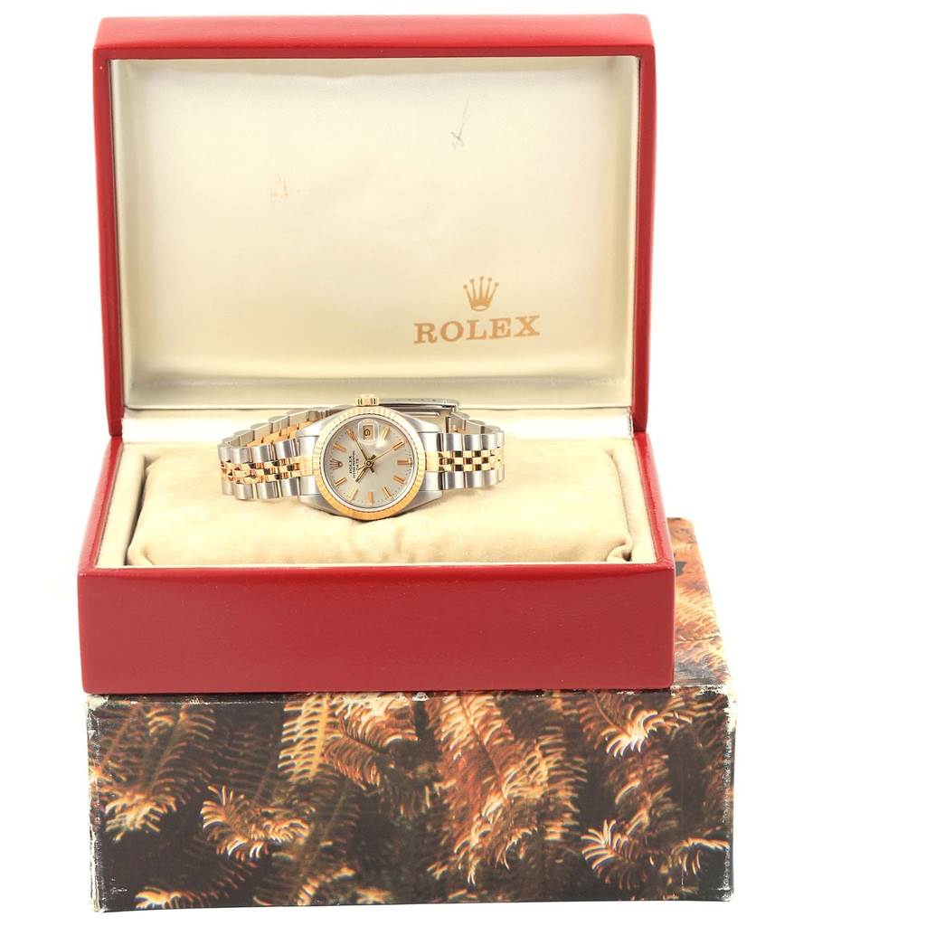The Rolex Datejust 69173 Women's Stainless Steel Silver Dial 69173 Women's Stainless Steel Silver Dial watch is shown from the front, placed inside an open red box with a beige interior.