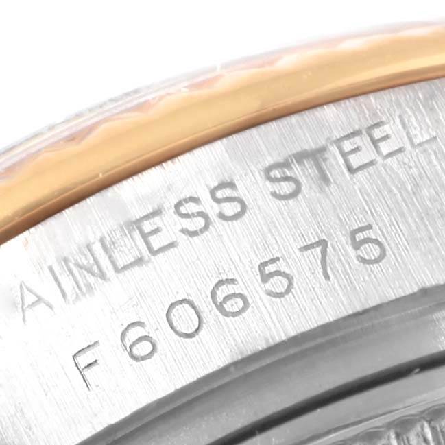 This image shows a close-up of the case and serial number engraving on a Rolex Datejust 179173 Women's Steel and Gold (two tone) Champagne Dial 179173 Women's Steel and Gold (two tone) Champagne Dial watch.