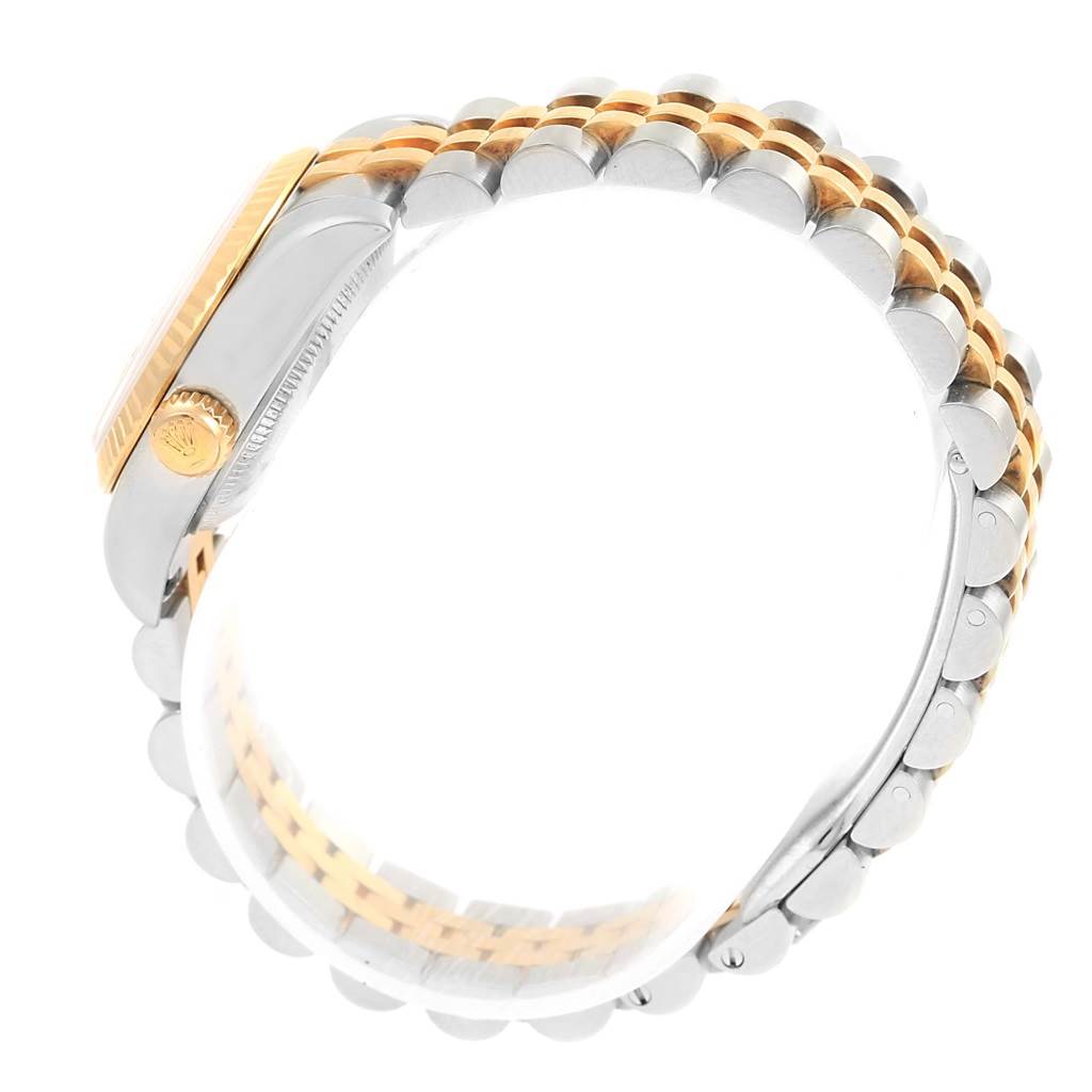 The image shows a side view of the Rolex Datejust 179173 Women's Steel and Gold (two tone) Champagne Dial 179173 Women's Steel and Gold (two tone) Champagne Dial watch, highlighting the bracelet and crown.