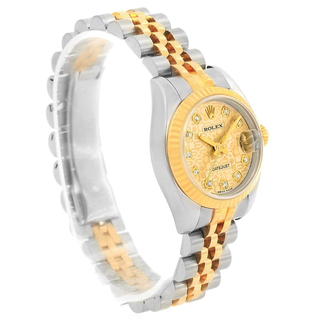 The Rolex Datejust 179173 Women's Steel and Gold (two tone) Champagne Dial 179173 Women's Steel and Gold (two tone) Champagne Dial watch is shown at a slight angle, displaying its face, bezel, and two-tone metal bracelet.