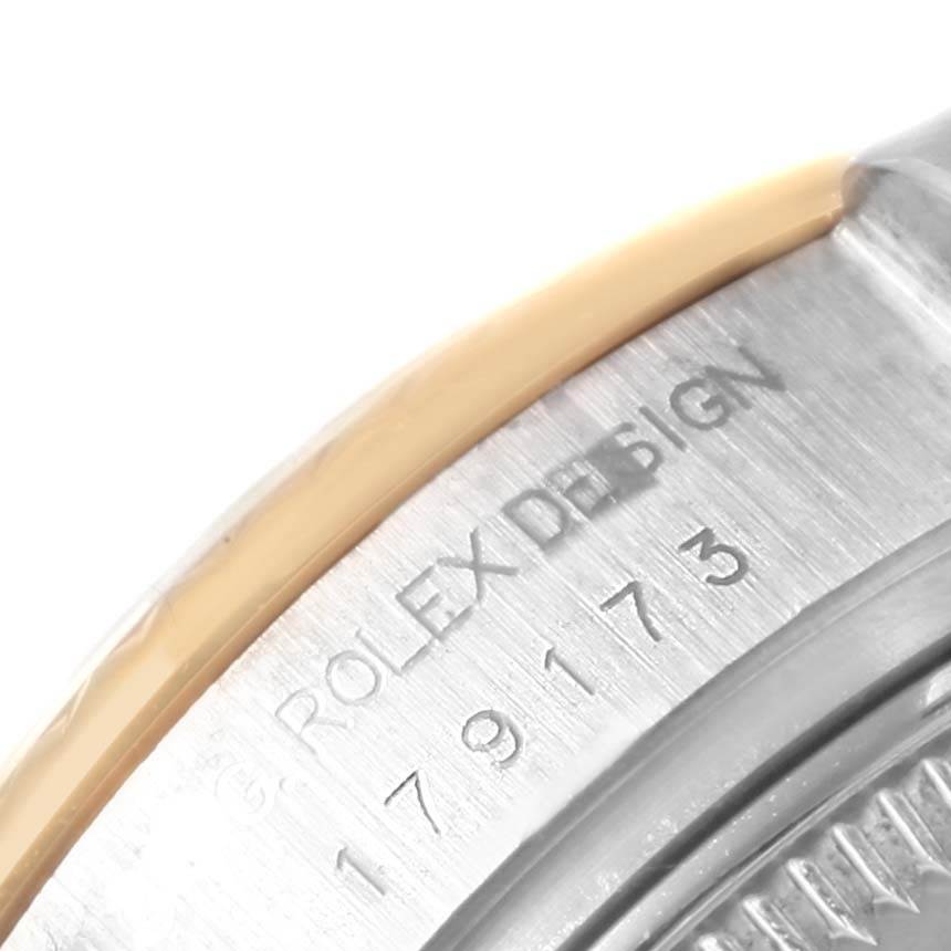 This image shows a close-up of the case back edge with engravings of the Rolex Datejust 179173 Women's Steel and Gold (two tone) Champagne Dial 179173 Women's Steel and Gold (two tone) Champagne Dial model.