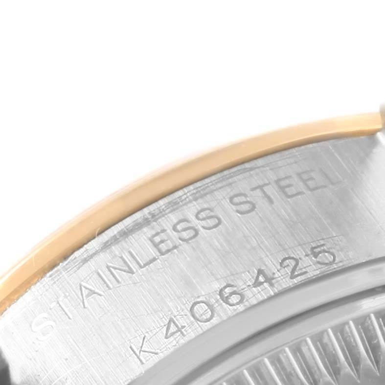 The image shows a close-up of the stainless steel and gold case back of a Rolex Datejust 79163 Women's Steel and Gold (two tone) Champagne Dial 79163 Women's Steel and Gold (two tone) Champagne Dial watch, featuring its serial number.