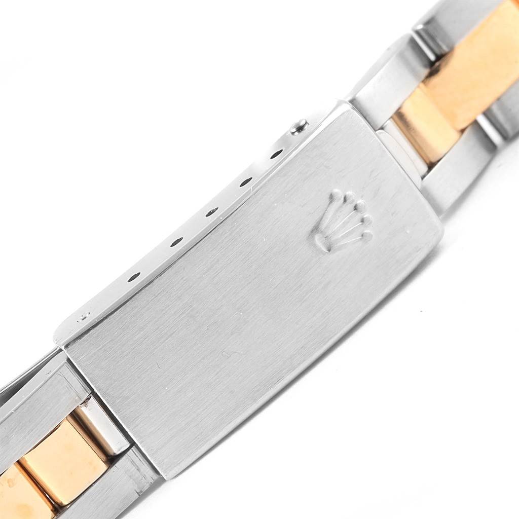 This image shows the clasp and bracelet of a Rolex Datejust 79163 Women's Steel and Gold (two tone) Champagne Dial 79163 Women's Steel and Gold (two tone) Champagne Dial watch, featuring the brand's crown logo.