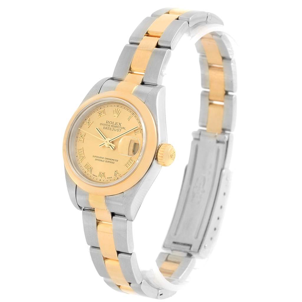 The Rolex Datejust 79163 Women's Steel and Gold (two tone) Champagne Dial 79163 Women's Steel and Gold (two tone) Champagne Dial watch is shown from a high side angle, displaying the gold and silver bracelet, and the gold-colored dial.