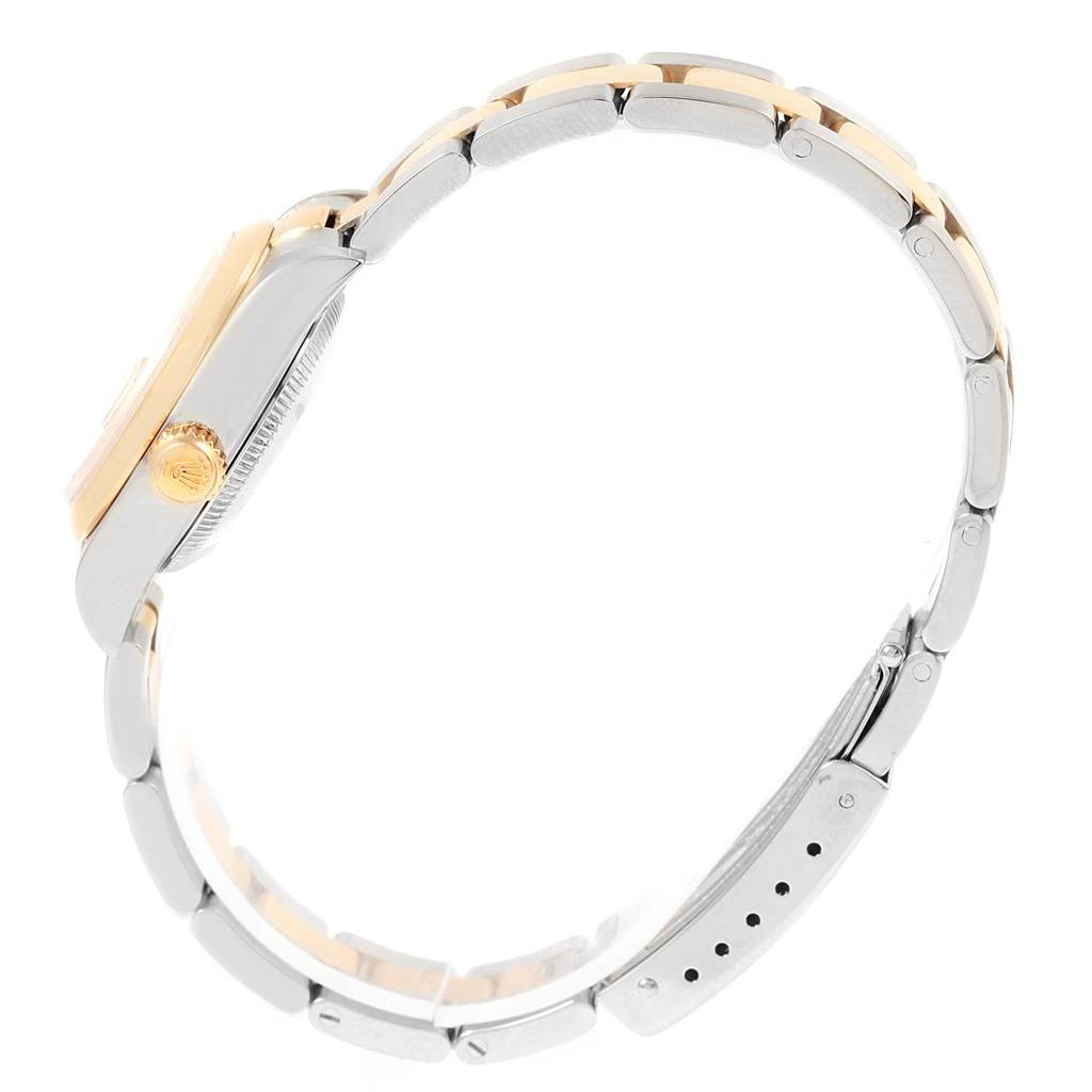 This image shows a side view of a Rolex Datejust 79163 Women's Steel and Gold (two tone) Champagne Dial 79163 Women's Steel and Gold (two tone) Champagne Dial watch, highlighting the crown, case, and part of the bracelet.