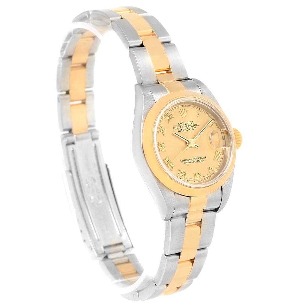 The image shows a Rolex Datejust 79163 Women's Steel and Gold (two tone) Champagne Dial 79163 Women's Steel and Gold (two tone) Champagne Dial watch at an angled side view, highlighting the bi-color metal band and the face.