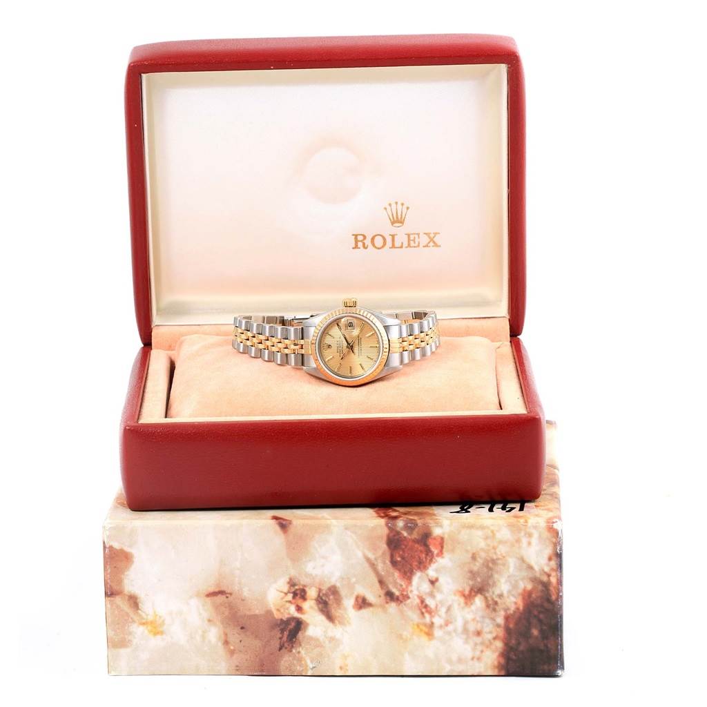 The Rolex Datejust 69173 Women's Stainless Steel Champagne Dial 69173 Women's Stainless Steel Champagne Dial watch is shown from the front, resting in an open Rolex-branded box.