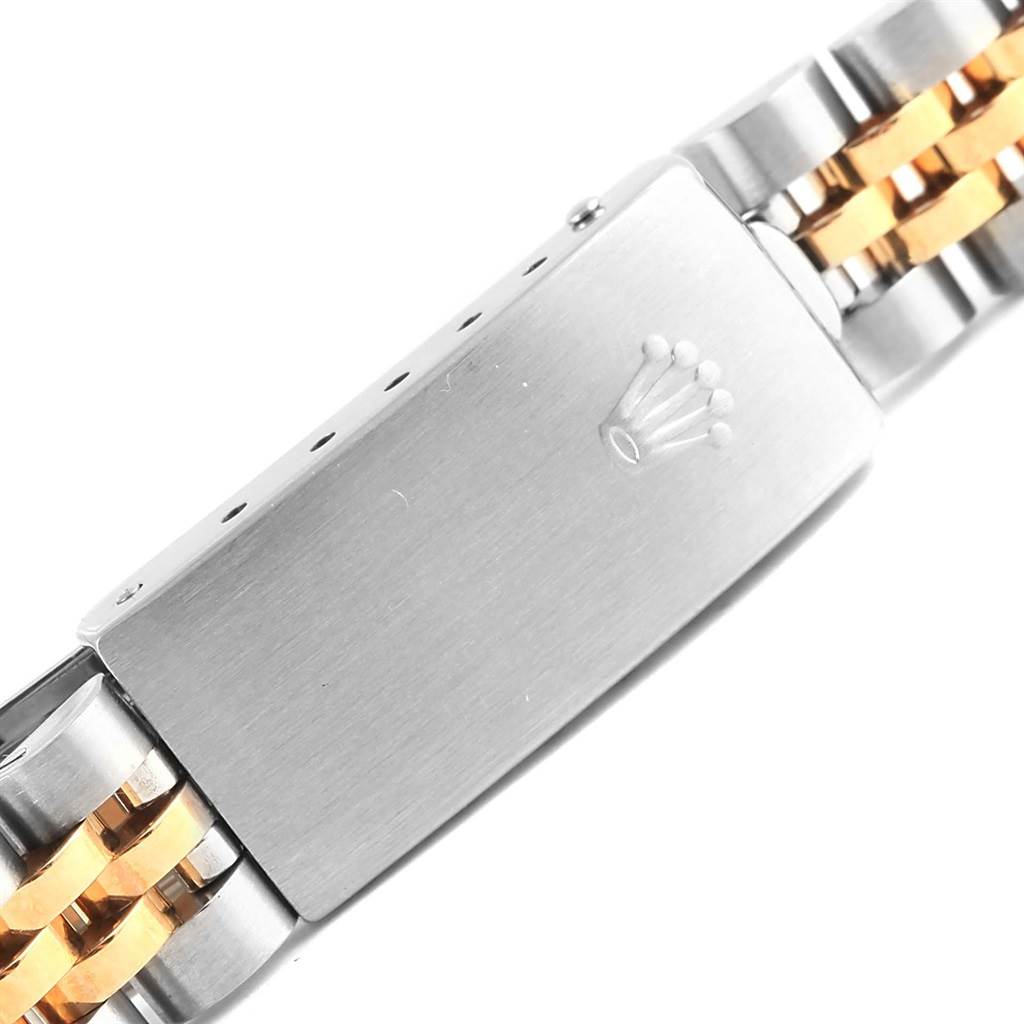This image shows a close-up of the bracelet clasp of a Rolex Datejust 69173 Women's Stainless Steel Champagne Dial 69173 Women's Stainless Steel Champagne Dial watch, featuring a two-tone metal design.