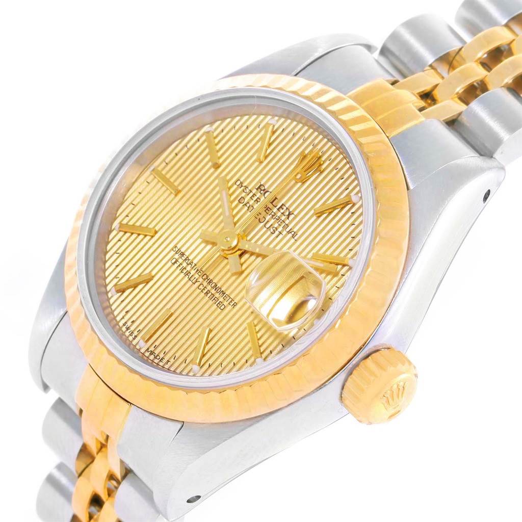 This image shows a close-up of the Rolex Datejust 69173 Women's Stainless Steel Champagne Dial 69173 Women's Stainless Steel Champagne Dial, including the gold dial, crown, fluted bezel, and part of the two-tone bracelet.