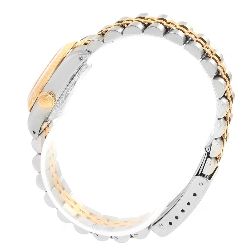 The image shows a side view of a Rolex Datejust 69173 Women's Stainless Steel Champagne Dial 69173 Women's Stainless Steel Champagne Dial watch, highlighting its gold and silver bracelet and crown.