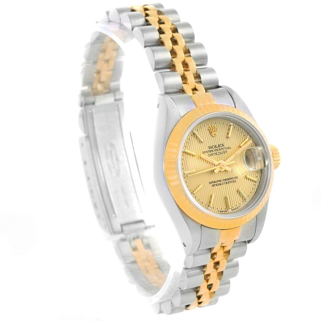 The image shows a side-angle view of a Rolex Datejust 69173 Women's Stainless Steel Champagne Dial 69173 Women's Stainless Steel Champagne Dial watch, highlighting its face, bezel, crown, and two-tone bracelet.