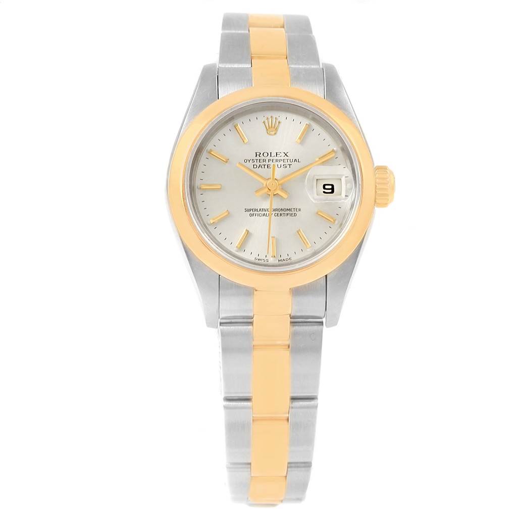 This Rolex Datejust 79163 Women's Steel and Gold (two tone) Silver Dial 79163 Women's Steel and Gold (two tone) Silver Dial watch is shown from a front angle, displaying its dial, bezel, and bi-metal bracelet.