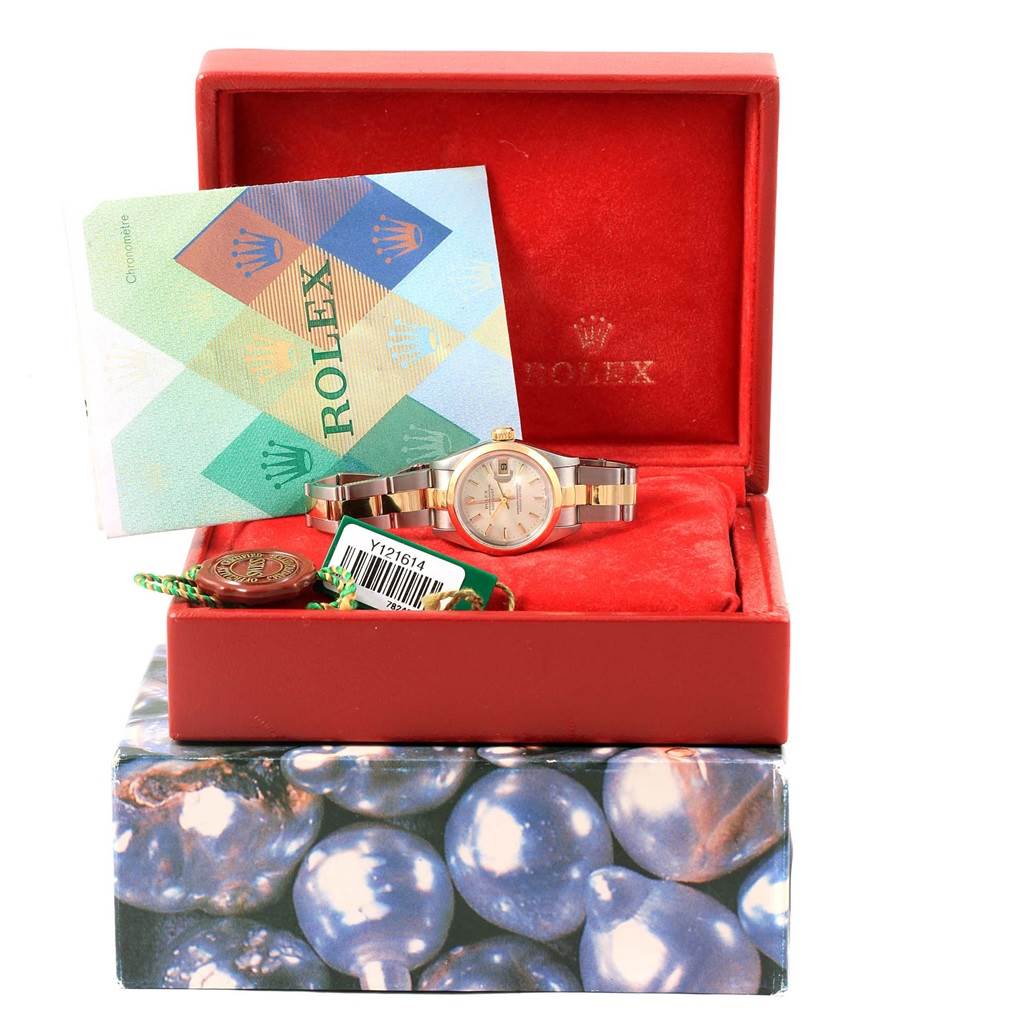 The image shows a Rolex Datejust 79163 Women's Steel and Gold (two tone) Silver Dial 79163 Women's Steel and Gold (two tone) Silver Dial watch inside an open red box, with accessories and a certificate booklet.