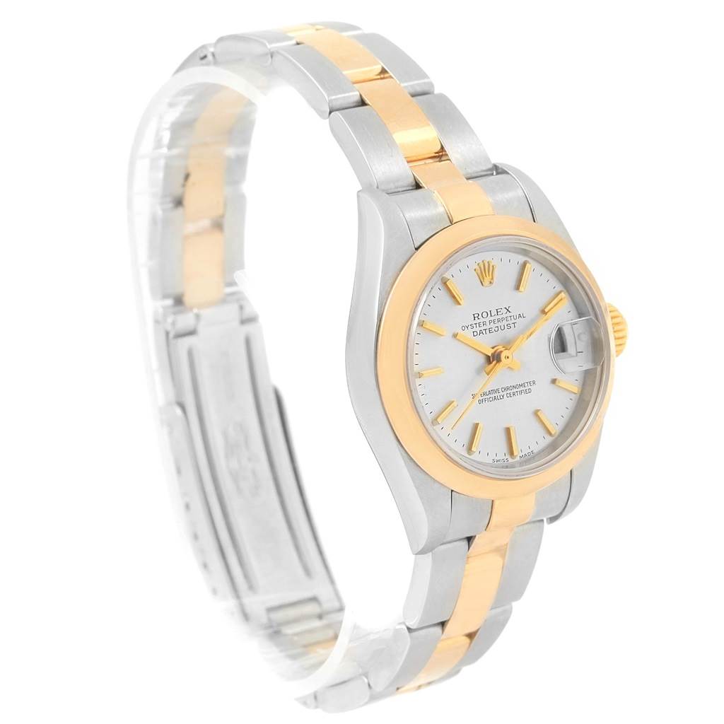 This image shows a Rolex Datejust 79163 Women's Steel and Gold (two tone) Silver Dial 79163 Women's Steel and Gold (two tone) Silver Dial watch from an angled side view, highlighting the face, bezel, case, and part of the bracelet.