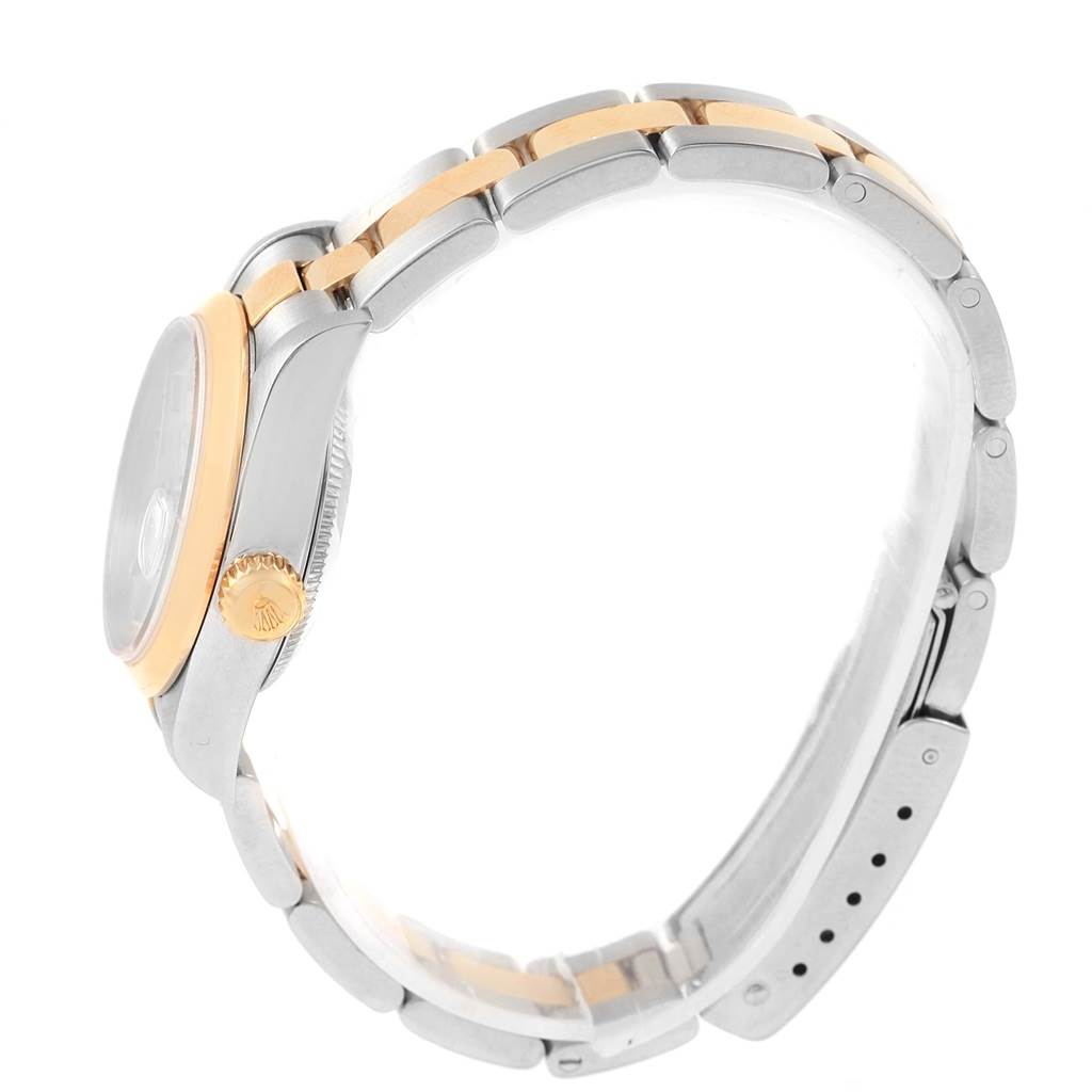 The image shows the side profile of a Rolex Datejust 79163 Women's Steel and Gold (two tone) Silver Dial 79163 Women's Steel and Gold (two tone) Silver Dial watch, highlighting the bracelet, crown, and case.