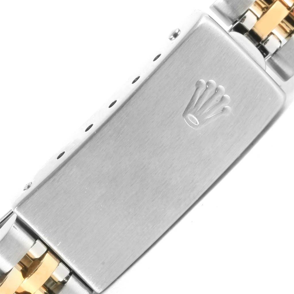 The image shows the clasp of a Rolex Datejust 69173 Women's Stainless Steel White Dial 69173 Women's Stainless Steel White Dial watch, highlighting the brand's logo and part of the bracelet.