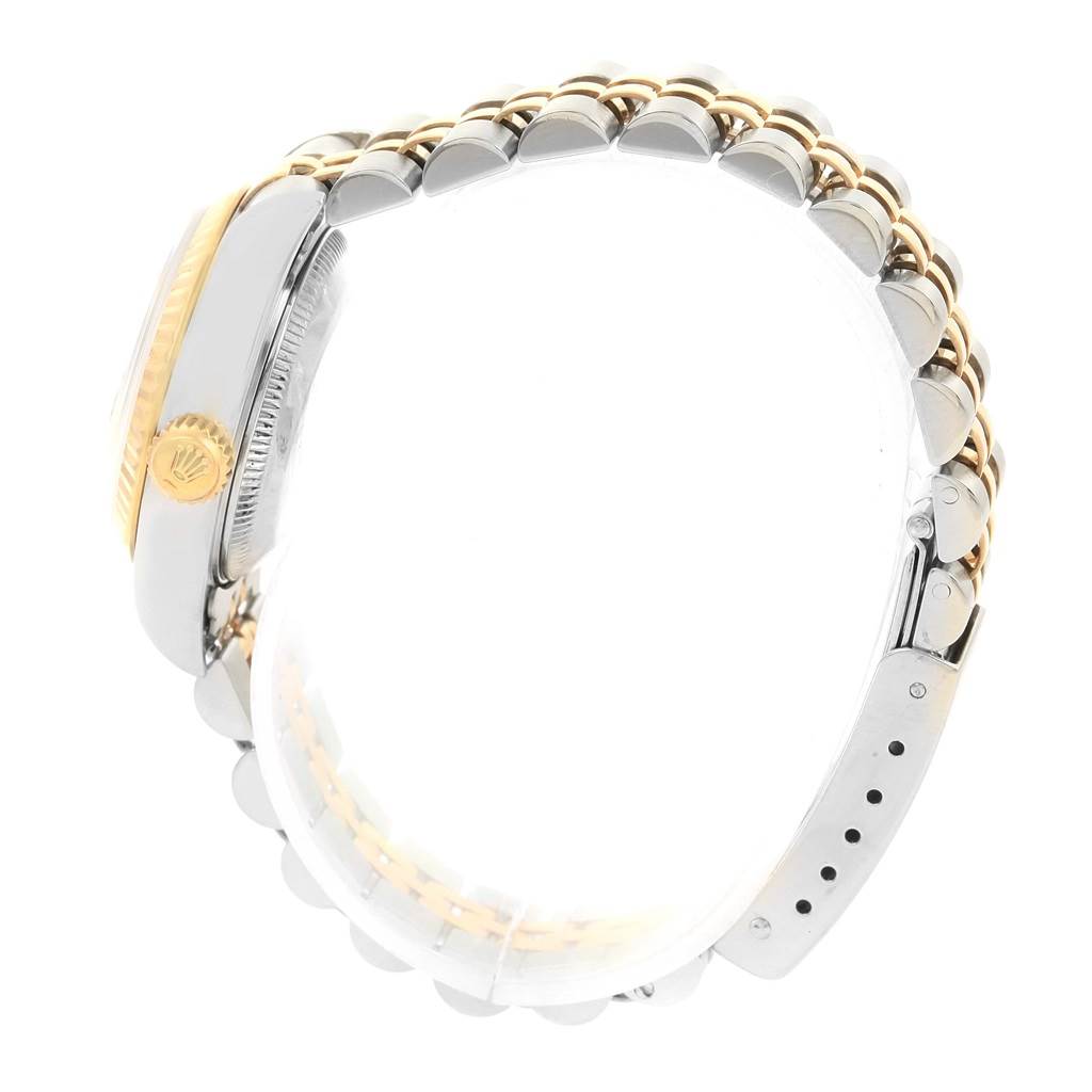 Side angle of a Rolex Datejust 69173 Women's Stainless Steel White Dial 69173 Women's Stainless Steel White Dial watch showing the crown, bezel, and part of the bracelet.