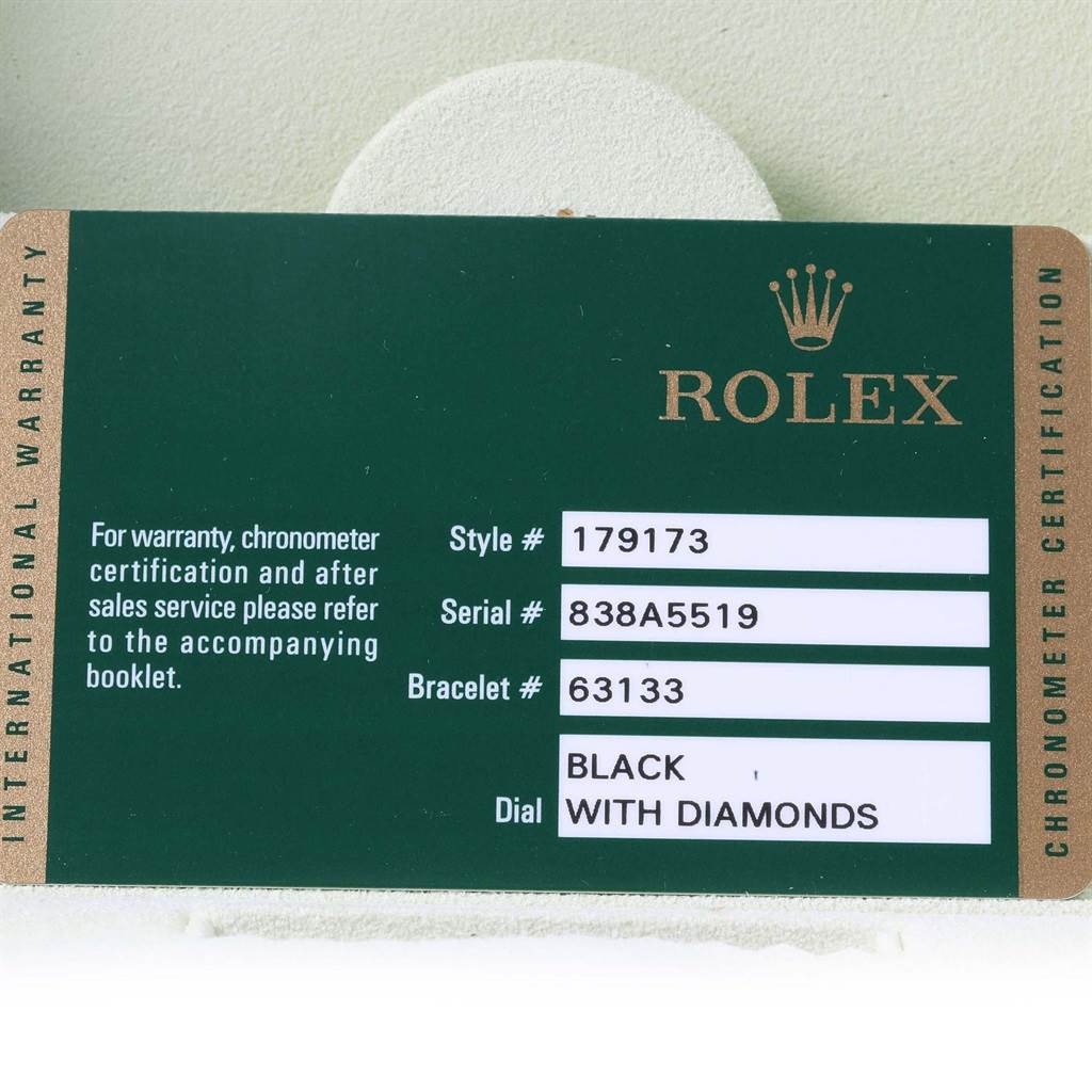 This image shows the warranty card for a Rolex Datejust 179173 Women's Steel and Gold (two tone) Black Dial 179173 Women's Steel and Gold (two tone) Black Dial, displaying model, serial, bracelet, and dial information.