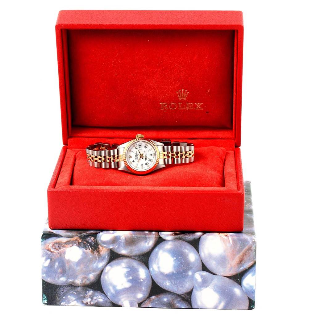 The Rolex Datejust 69173 Women's Stainless Steel White Dial 69173 Women's Stainless Steel White Dial watch is shown front-facing, displayed in an open red box, highlighting its face, bracelet, and packaging.