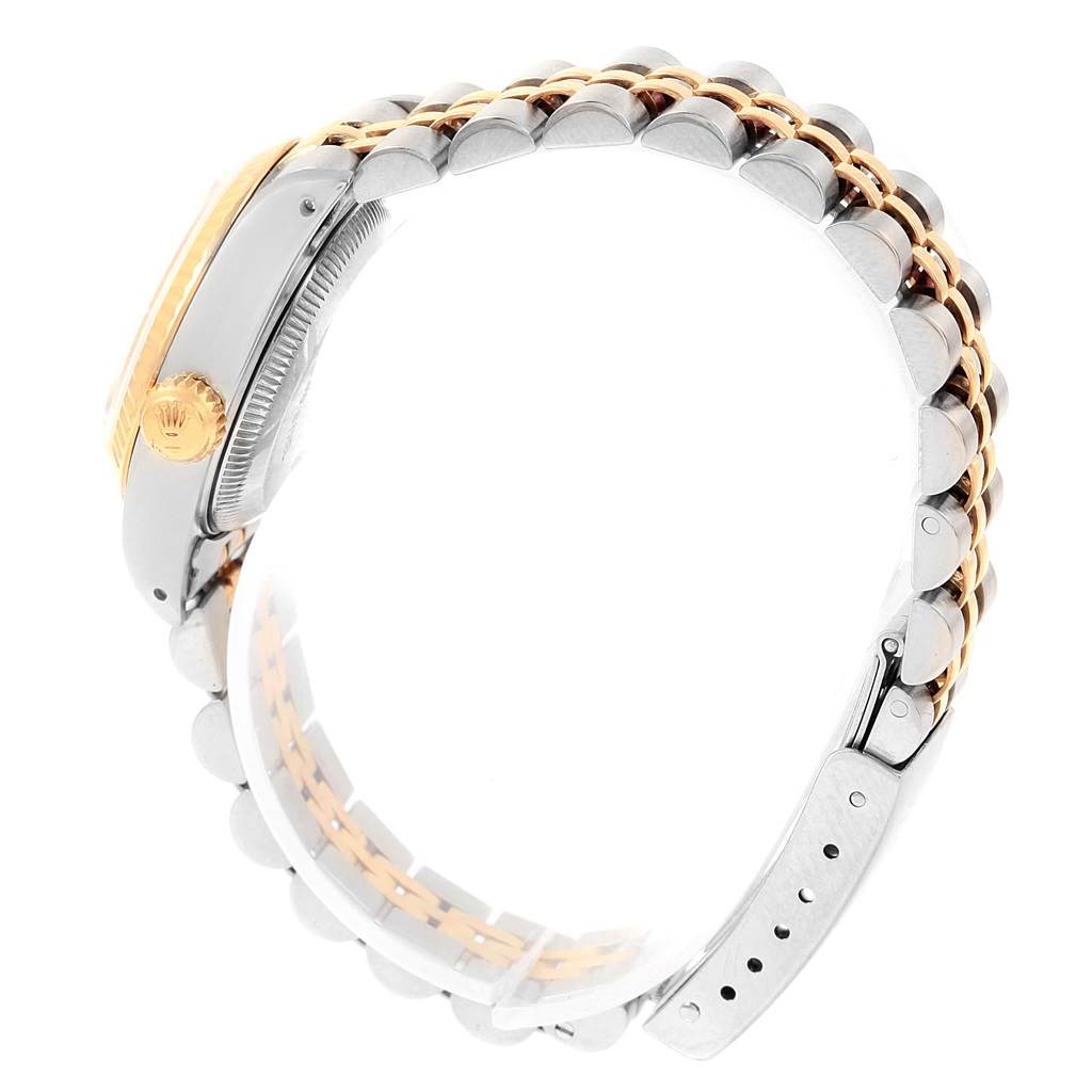 The image shows a side angle of the Rolex Datejust 69173 Women's Stainless Steel White Dial 69173 Women's Stainless Steel White Dial watch, highlighting the crown, case, and two-tone bracelet.