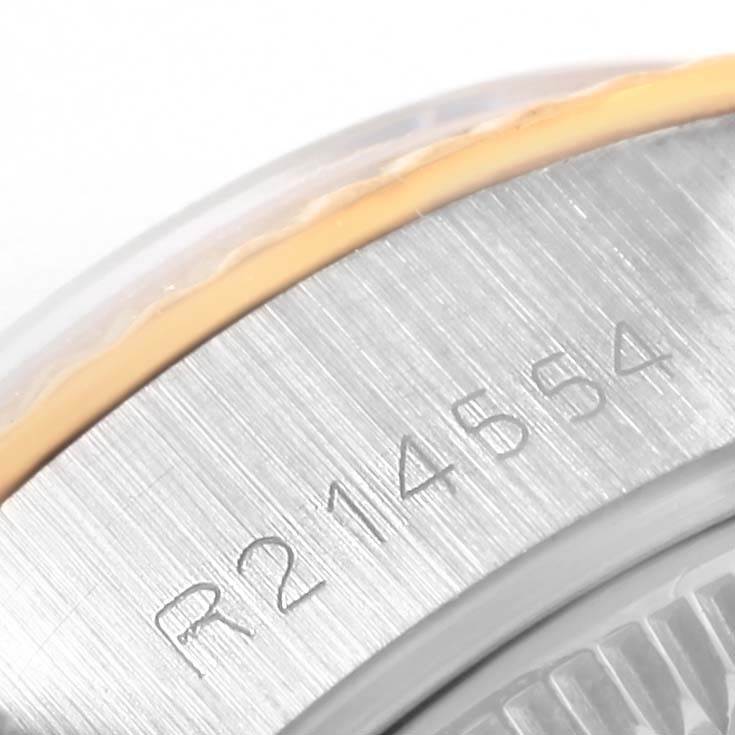 This is a close-up angle showing the serial number engraving on the case of a Rolex Datejust 69173 Women's Stainless Steel White Dial 69173 Women's Stainless Steel White Dial watch.