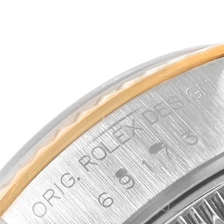 This close-up image depicts the bezel and part of the rehaut of a Rolex Datejust 69173 Women's Stainless Steel Silver Dial 69173 Women's Stainless Steel Silver Dial watch.