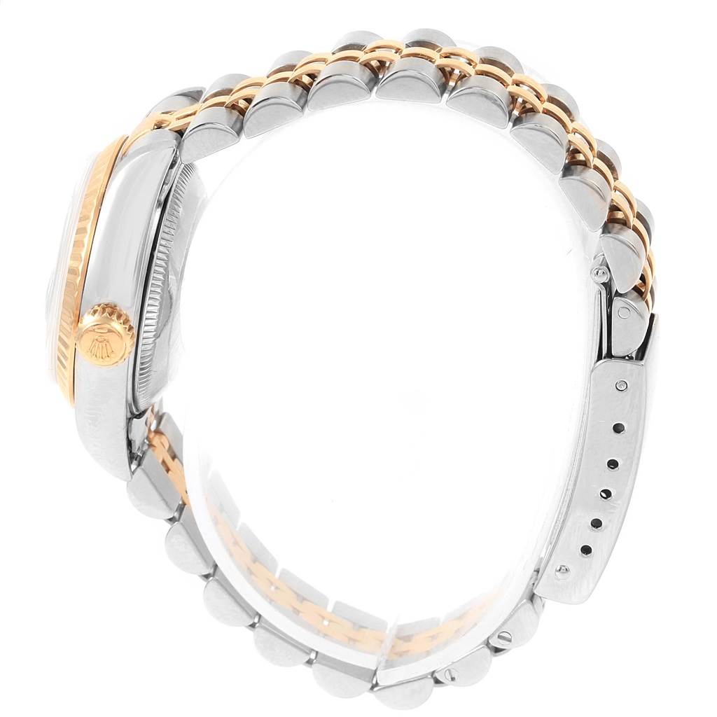 The image shows a side view of the Rolex Datejust 69173 Women's Stainless Steel Blue Dial 69173 Women's Stainless Steel Blue Dial watch, highlighting its crown, bezel, and bracelet.