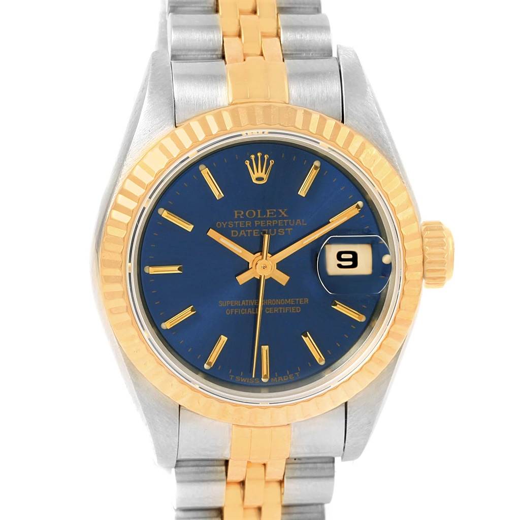 The image shows a front view of a Rolex Datejust 69173 Women's Stainless Steel Blue Dial 69173 Women's Stainless Steel Blue Dial watch featuring a two-tone metal band, gold bezel, and blue dial with a date display.