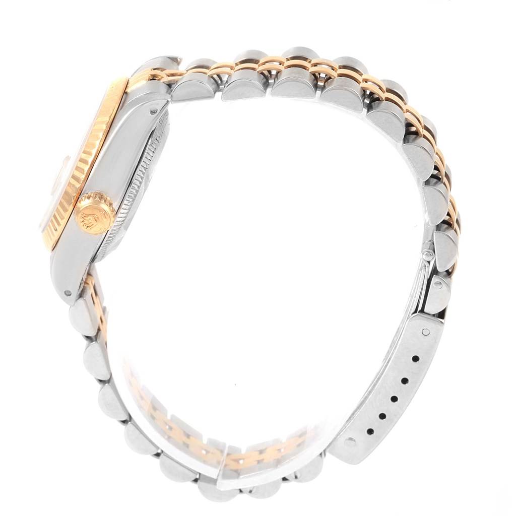 The image shows a side view of a Rolex Datejust 69173 Women's Stainless Steel Silver Dial 69173 Women's Stainless Steel Silver Dial model focusing on its crown, case, and jubilee bracelet.