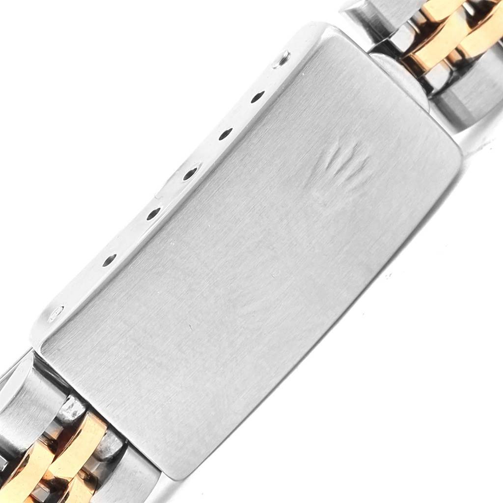 This image shows a close-up of the clasp on a Rolex Datejust 69173 Women's Stainless Steel Silver Dial 69173 Women's Stainless Steel Silver Dial watch, featuring its two-tone bracelet.