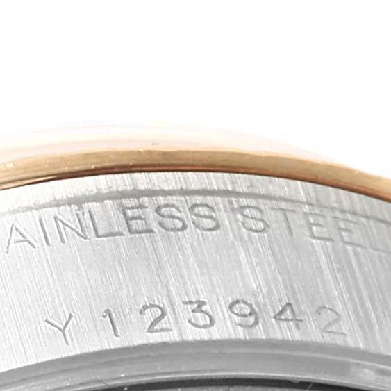 The image shows a close-up of the serial number and "STAINLESS STEEL" inscription on the case of a Rolex Datejust 79173 Women's Steel and Gold (two tone) White Dial 79173 Women's Steel and Gold (two tone) White Dial watch.