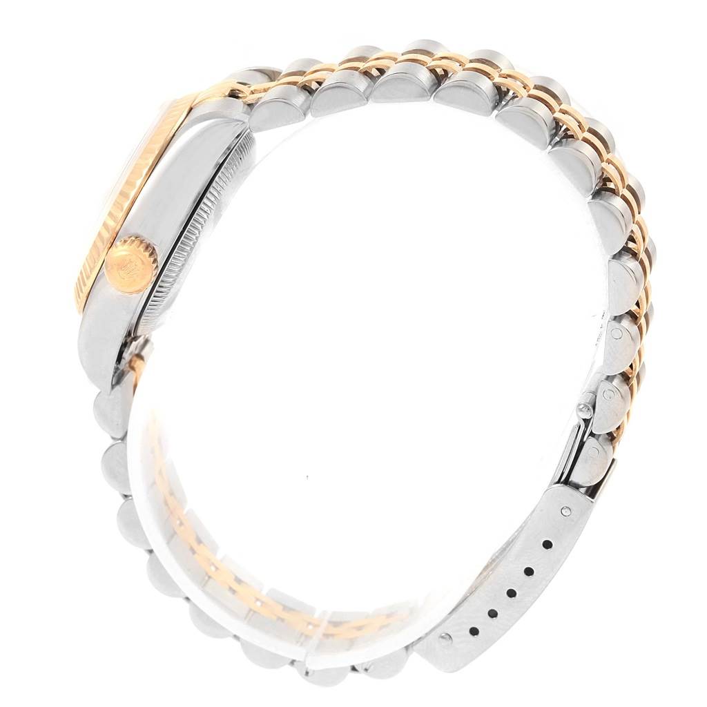 The image shows a side view of the Rolex Datejust 79173 Women's Steel and Gold (two tone) White Dial 79173 Women's Steel and Gold (two tone) White Dial watch, highlighting its two-tone bracelet and crown.