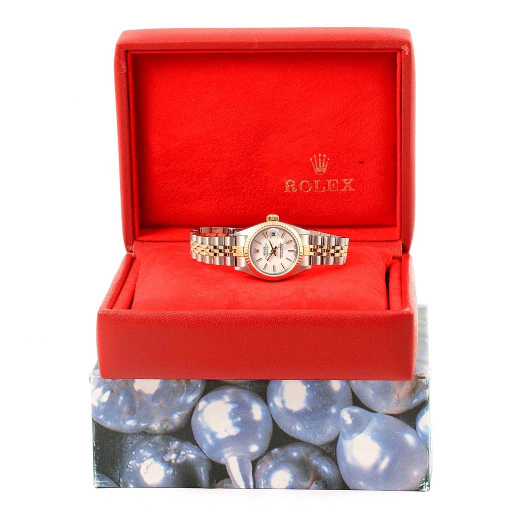 The Rolex Datejust 79173 Women's Steel and Gold (two tone) White Dial 79173 Women's Steel and Gold (two tone) White Dial watch is shown in its open display box, resting on a red cushion.