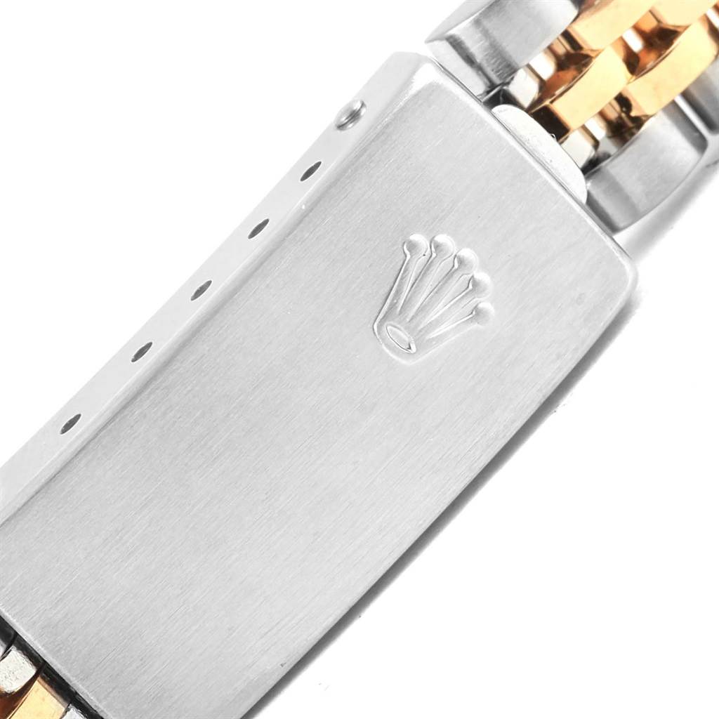 The image shows a close-up view of the clasp mechanism of a Rolex Datejust 79173 Women's Steel and Gold (two tone) White Dial 79173 Women's Steel and Gold (two tone) White Dial watch, featuring the Rolex crown logo.