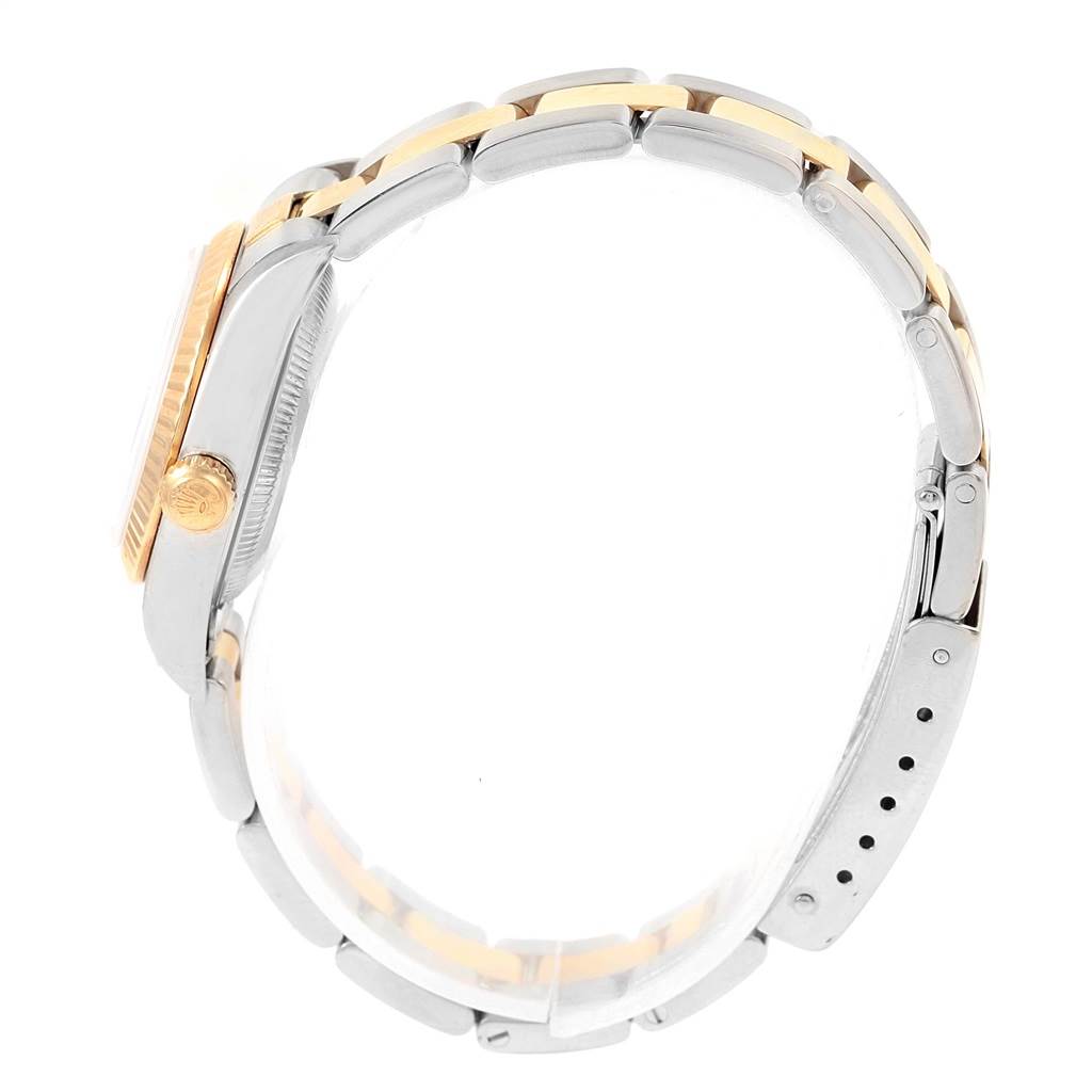 The image shows a side profile of a Rolex Datejust 76193 Women's Steel and Gold (two tone) Blue Dial 76193 Women's Steel and Gold (two tone) Blue Dial watch, highlighting the bracelet and crown.