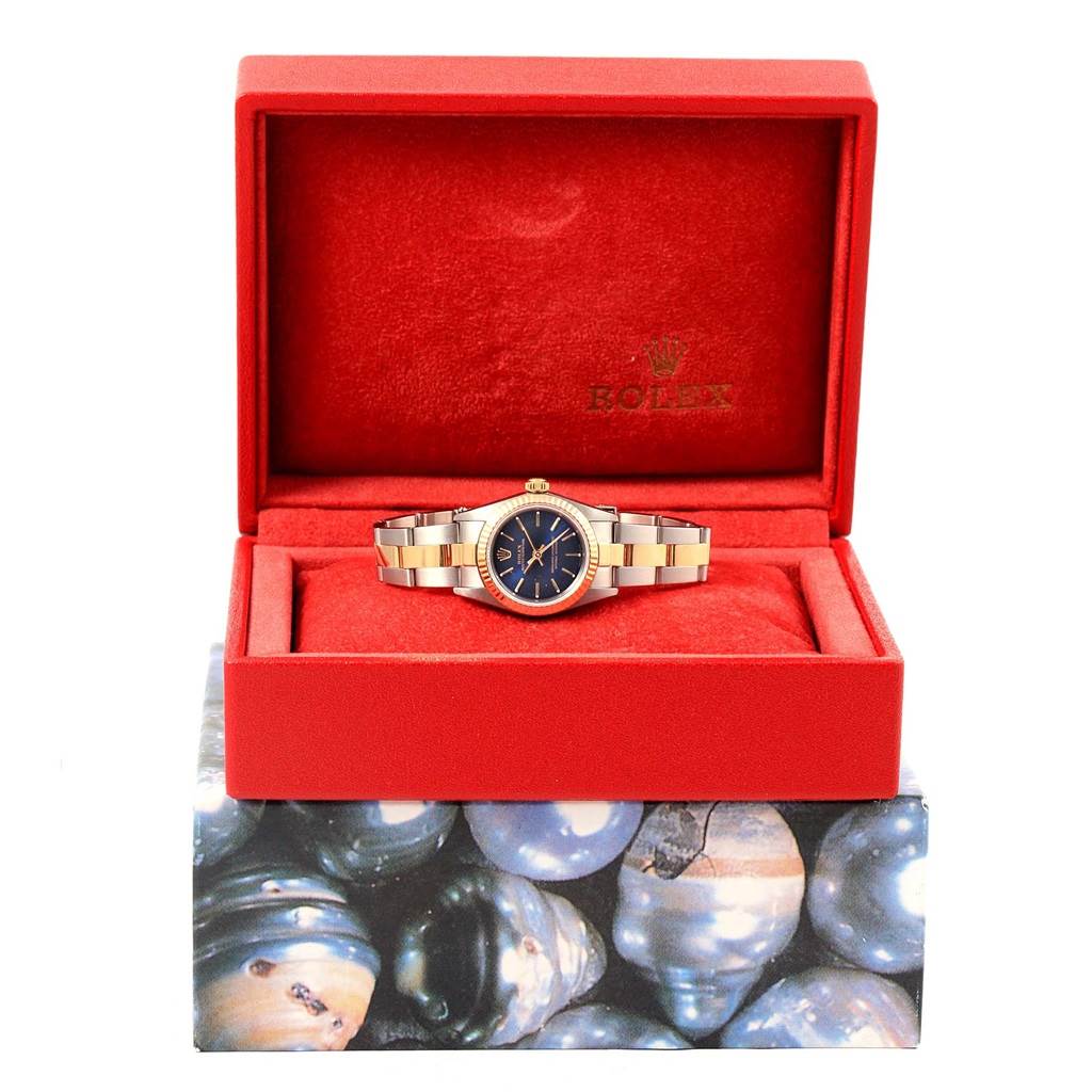 The Rolex Datejust 76193 Women's Steel and Gold (two tone) Blue Dial 76193 Women's Steel and Gold (two tone) Blue Dial watch is shown from the front inside an open red box with a black dial and two-tone bracelet.