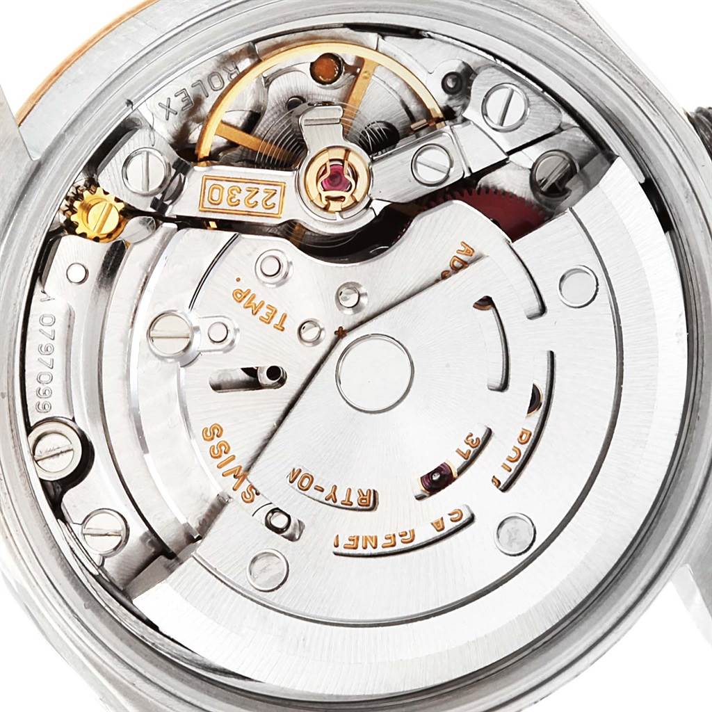 This image shows the intricate movement mechanism of a Rolex Datejust 76193 Women's Steel and Gold (two tone) Blue Dial 76193 Women's Steel and Gold (two tone) Blue Dial watch from a close-up, inner angle.
