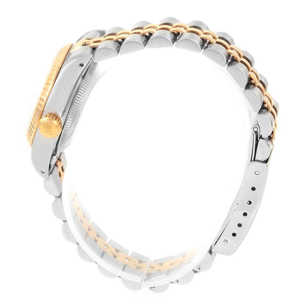 This side view image of the Rolex Datejust 69173 Women's Stainless Steel Silver Dial 69173 Women's Stainless Steel Silver Dial watch shows the crown, case, and two-tone bracelet.