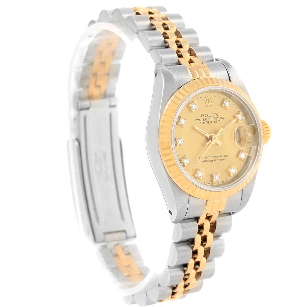 The image shows a side angle of a Rolex Datejust 69173 Women's Stainless Steel Champagne Dial 69173 Women's Stainless Steel Champagne Dial watch featuring a two-tone bracelet and a gold dial with a fluted bezel.