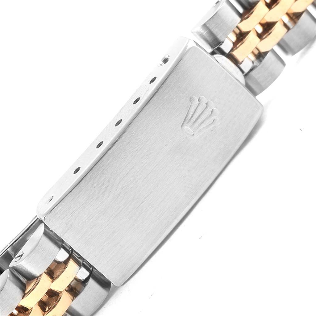 The image shows a close-up of the clasp and part of the bracelet of a Rolex Datejust 69173 Women's Stainless Steel Champagne Dial 69173 Women's Stainless Steel Champagne Dial, featuring both silver and gold links.