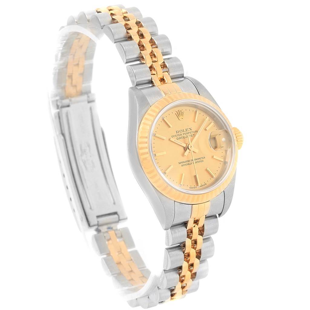 This image shows a Rolex Datejust 79173 Women's Steel and Gold (two tone) Champagne Dial 79173 Women's Steel and Gold (two tone) Champagne Dial watch at an angle, displaying its face, bezel, crown, and two-tone bracelet.