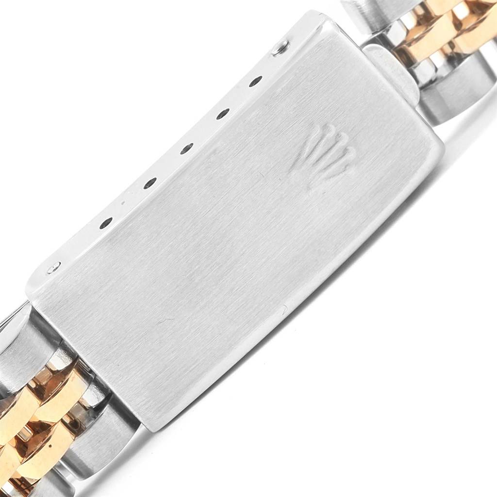 This image shows a close-up view of the clasp and bracelet of a Rolex Datejust 79173 Women's Steel and Gold (two tone) Champagne Dial 79173 Women's Steel and Gold (two tone) Champagne Dial watch.