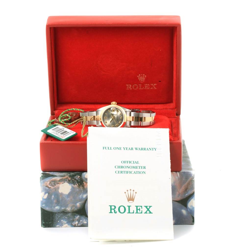 The image shows a Rolex Datejust 69163 Women's Stainless Steel Grey Dial 69163 Women's Stainless Steel Grey Dial watch front view with its box and warranty papers.
