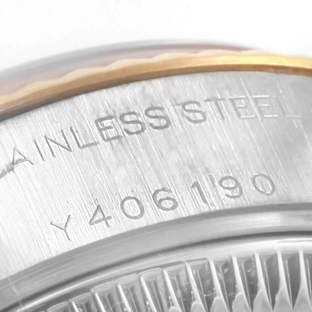 This close-up angle shows the serial number and "Stainless Steel" engraving on the Rolex Datejust 79173 Women's Steel and Gold (two tone) Blue Dial 79173 Women's Steel and Gold (two tone) Blue Dial watch case.