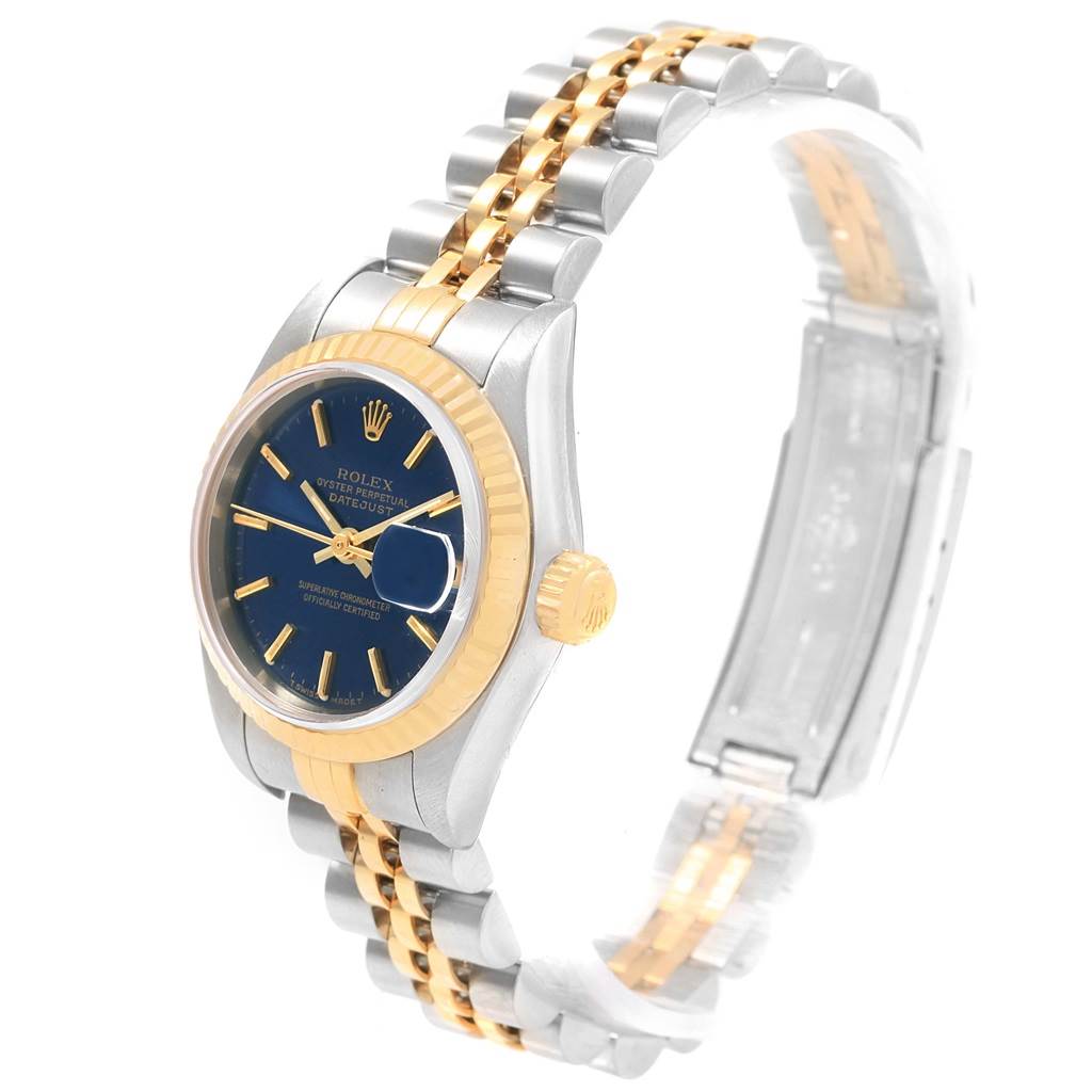 The Rolex Datejust 79173 Women's Steel and Gold (two tone) Blue Dial 79173 Women's Steel and Gold (two tone) Blue Dial watch is shown at an angled front view, highlighting its blue dial, fluted bezel, and two-tone bracelet.