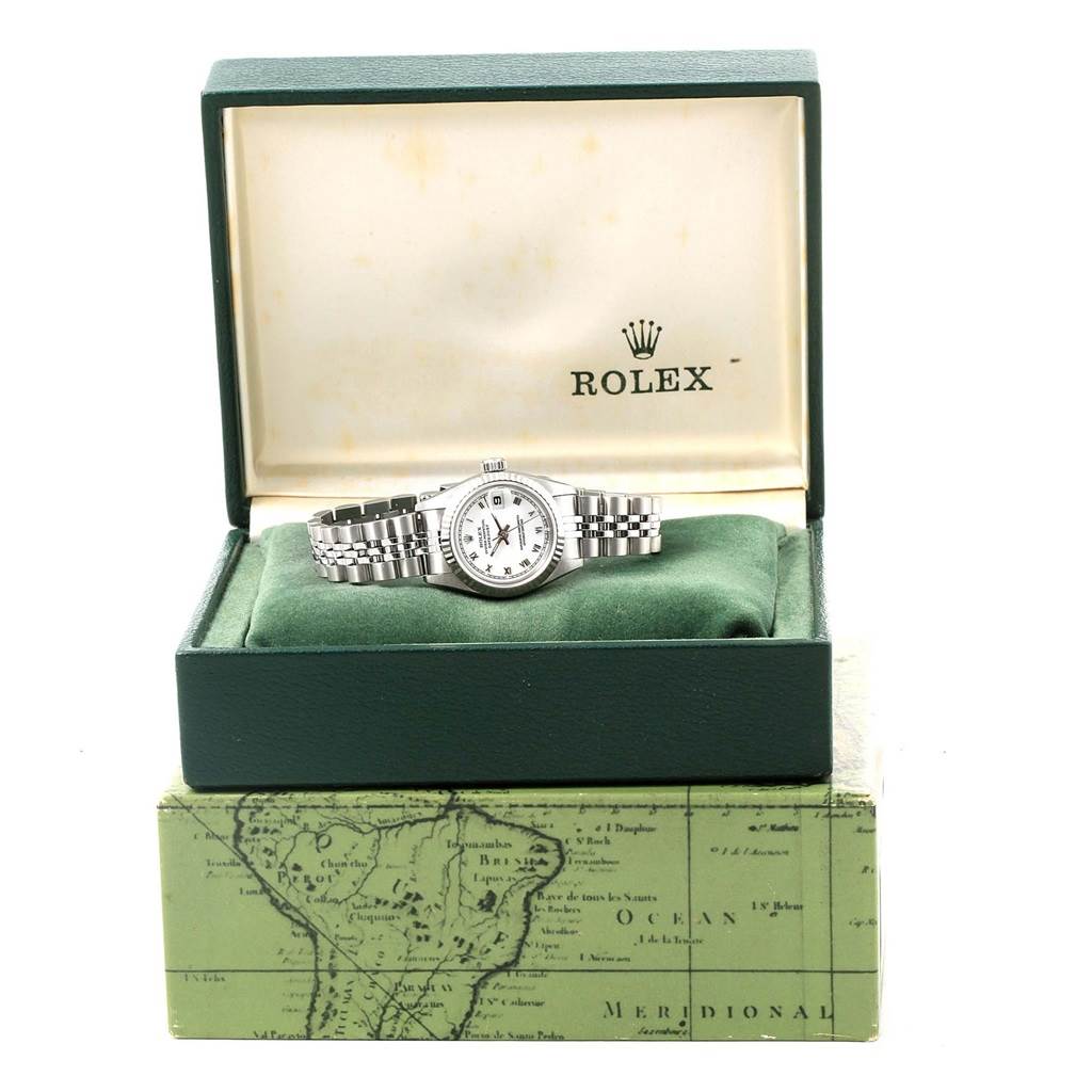 A Rolex Datejust 69174 Women's Stainless Steel White Dial 69174 Women's Stainless Steel White Dial watch is shown from a front angle, inside its open box with the brand logo visible.