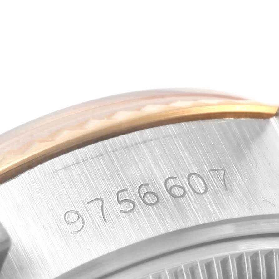 This close-up image shows the serial number engraved on the side of a Rolex Datejust 69173 Women's Stainless Steel Champagne Dial 69173 Women's Stainless Steel Champagne Dial watch case.